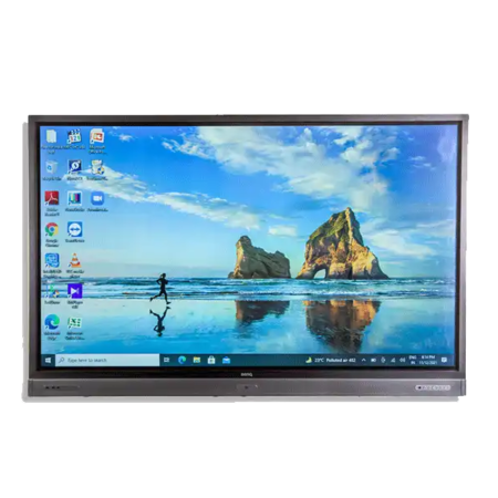 UHD monitor rental showing desktop with beach and rock formations wallpaper. Desktop icons and taskbar open, ready to go in a office or educational environment. Monitor shows off its high definition and clarity, perfect for presentations, video conferencing or interactive displays. Sleek design to fit any workspace.