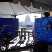 Outdoor video wall rental setup in Washington DC for a professional event with a Capitol Hill backdrop, including cameras and stage lighting equipment
