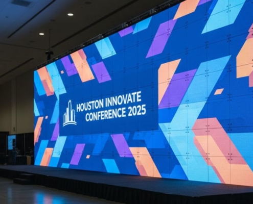 A close-up view of the base of a ground-supported LED video wall, demonstrating the seamless and calibrated panel configuration for a crisp, vivid visual display.