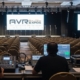 AVR Expos technicians managing audio visual setup at a corporate conference.