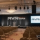 Corporate event audio setup with wireless microphones and speakers from AVR Expos.