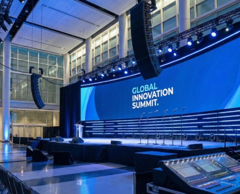 Audio speakers and microphones set up for a Chicago conference event with balanced sound coverage.