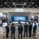 Live product demo using professional AV displays and audio equipment at an event