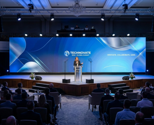 Corporate conference stage with LED background and lighting design