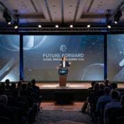 Large LED video wall used as stage backdrop for corporate conference presentation