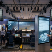 Attendee using touchscreen kiosk at corporate event